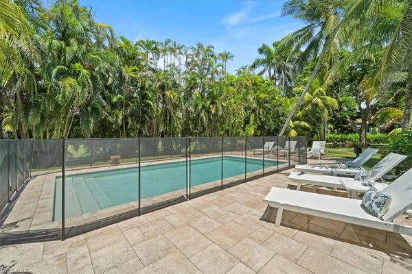 a view of a backyard with sitting area