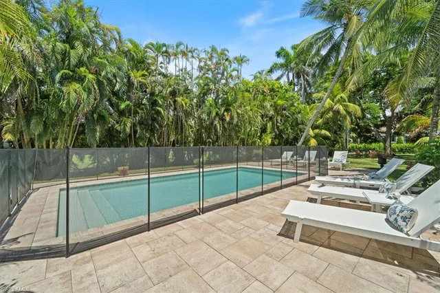 a view of a backyard with sitting area
