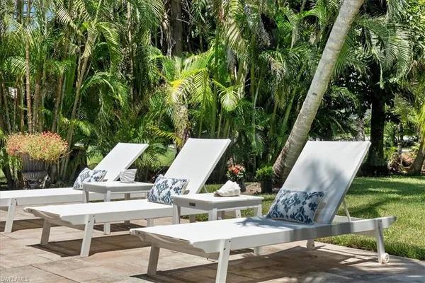 a view of outdoor sitting area with furniture