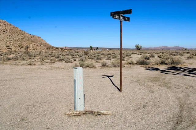a view of a building with mountains in the background