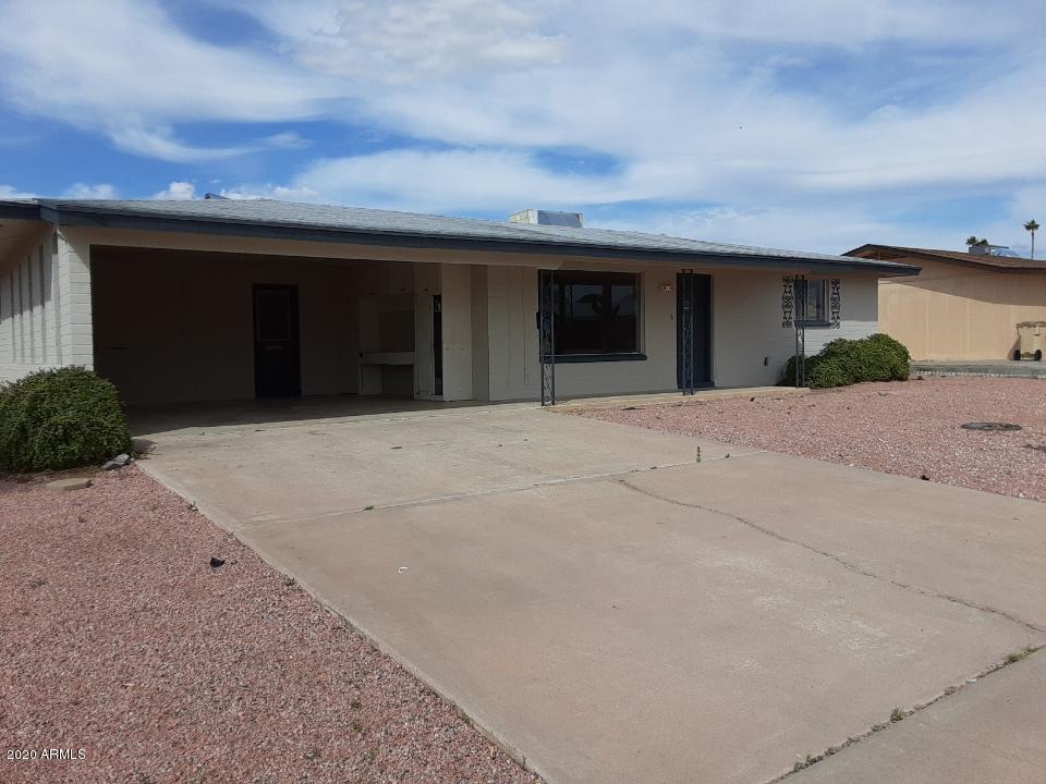 5662 East Decatur Street Mesa, AZ 85205 - Photo 1 of 7 a front view of a house with a yard