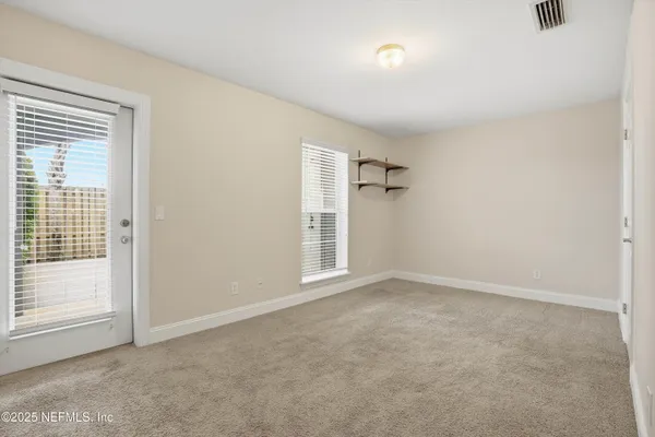 an empty room with windows