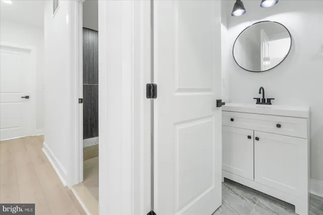a bathroom with a sink and a mirror