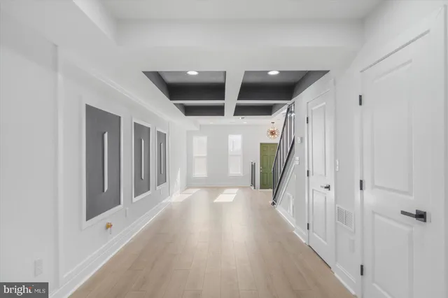 a view of entryway with stairs and wooden floor