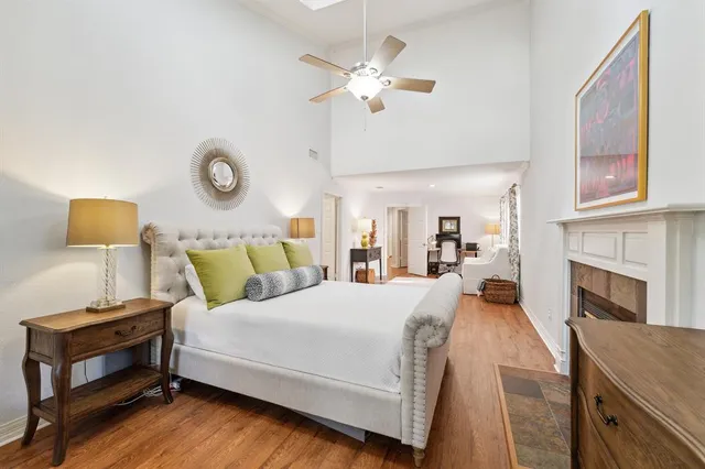 a living room with a bed furniture and a fireplace