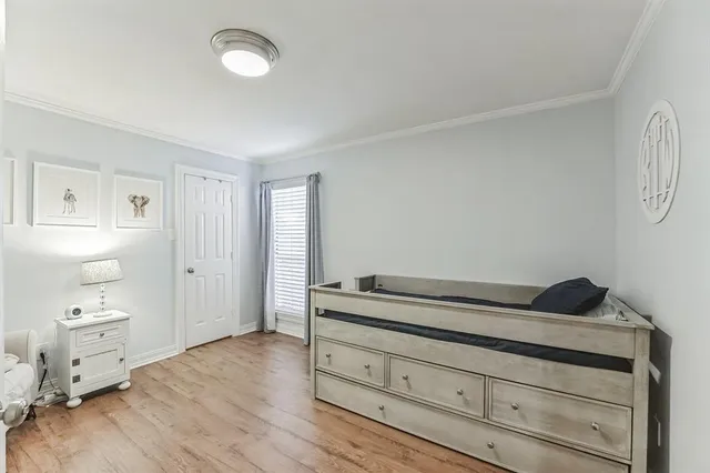 a view of room with wooden floor