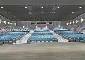 6193 Pointe Regal Circle, Unit 304 Delray Beach, FL 33484 - Photo 14 of 15 a large room with a kitchen island a large island in the center