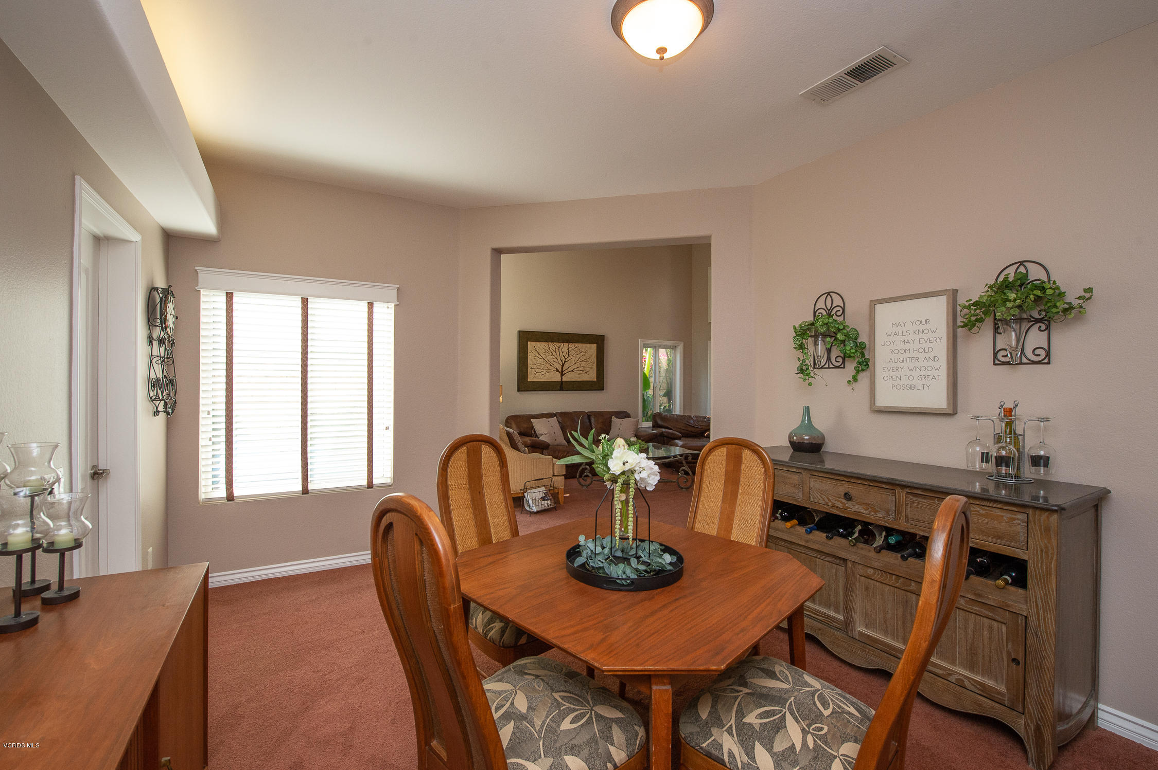 7354 Griffith Lane Moorpark, CA 93021 - Photo 11 of 53 a dining room with furniture a window and wooden floor