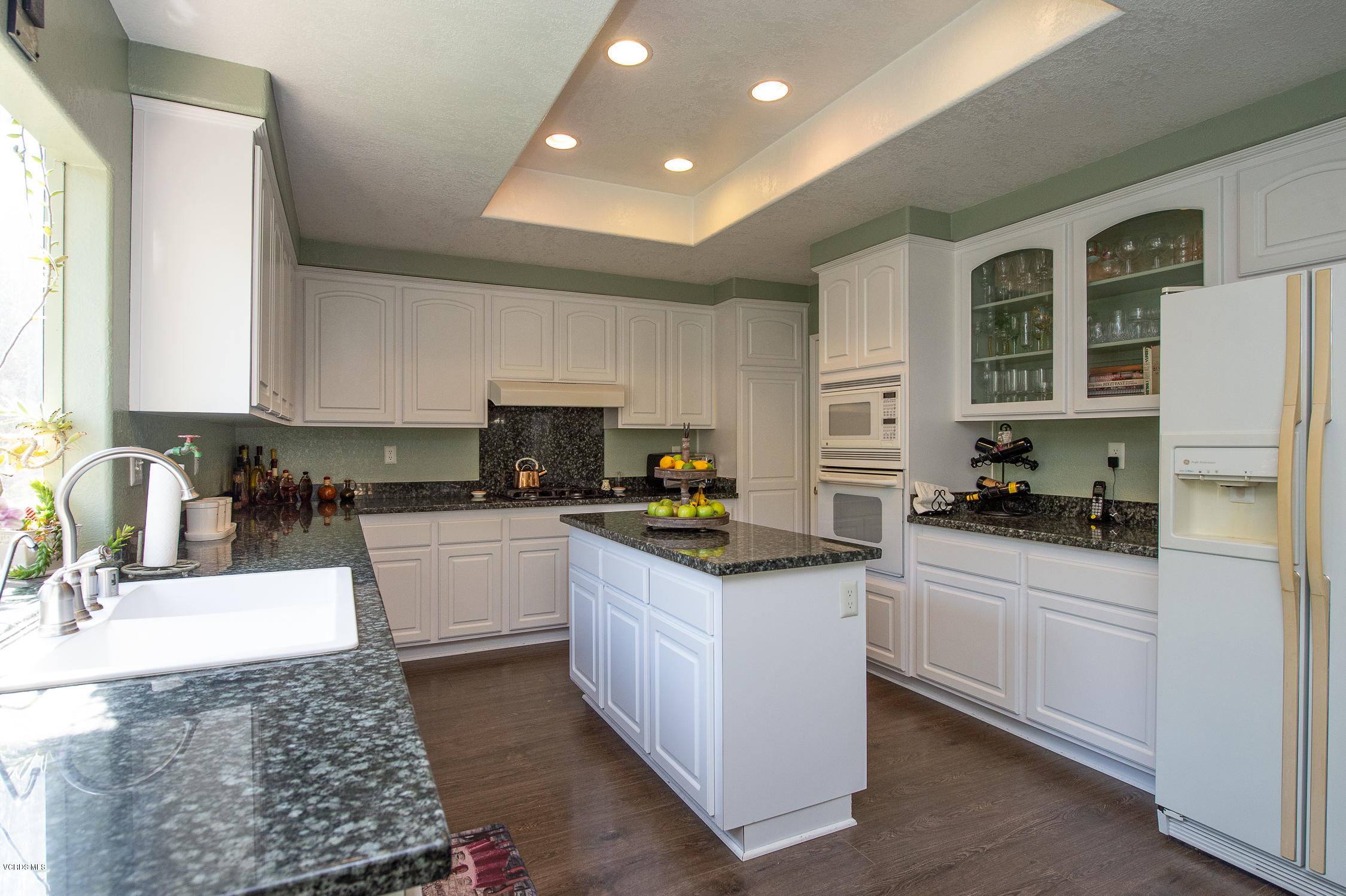 7354 Griffith Lane Moorpark, CA 93021 - Photo 17 of 53 a kitchen with stainless steel appliances granite countertop a sink stove and refrigerator