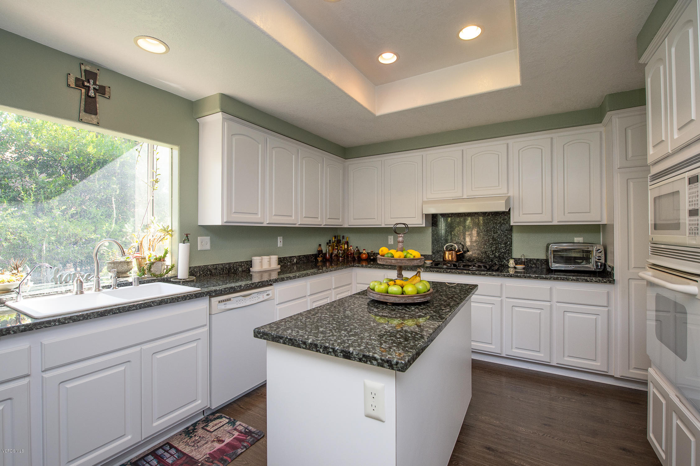 7354 Griffith Lane Moorpark, CA 93021 - Photo 20 of 53 a kitchen with a sink a stove cabinets and counter space