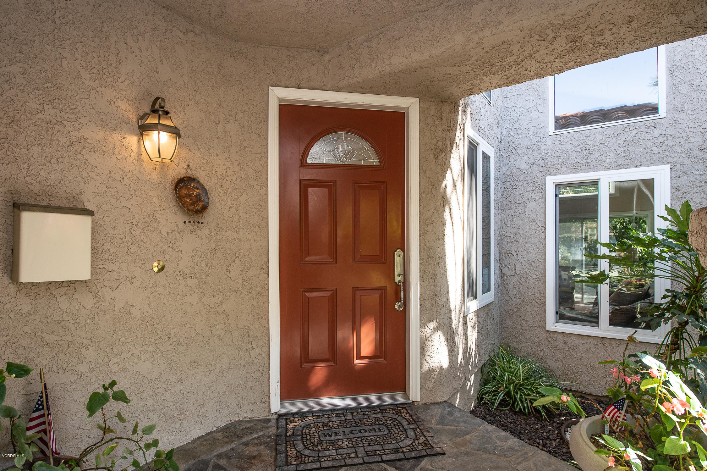 7354 Griffith Lane Moorpark, CA 93021 - Photo 3 of 53 a front view of a house with garden