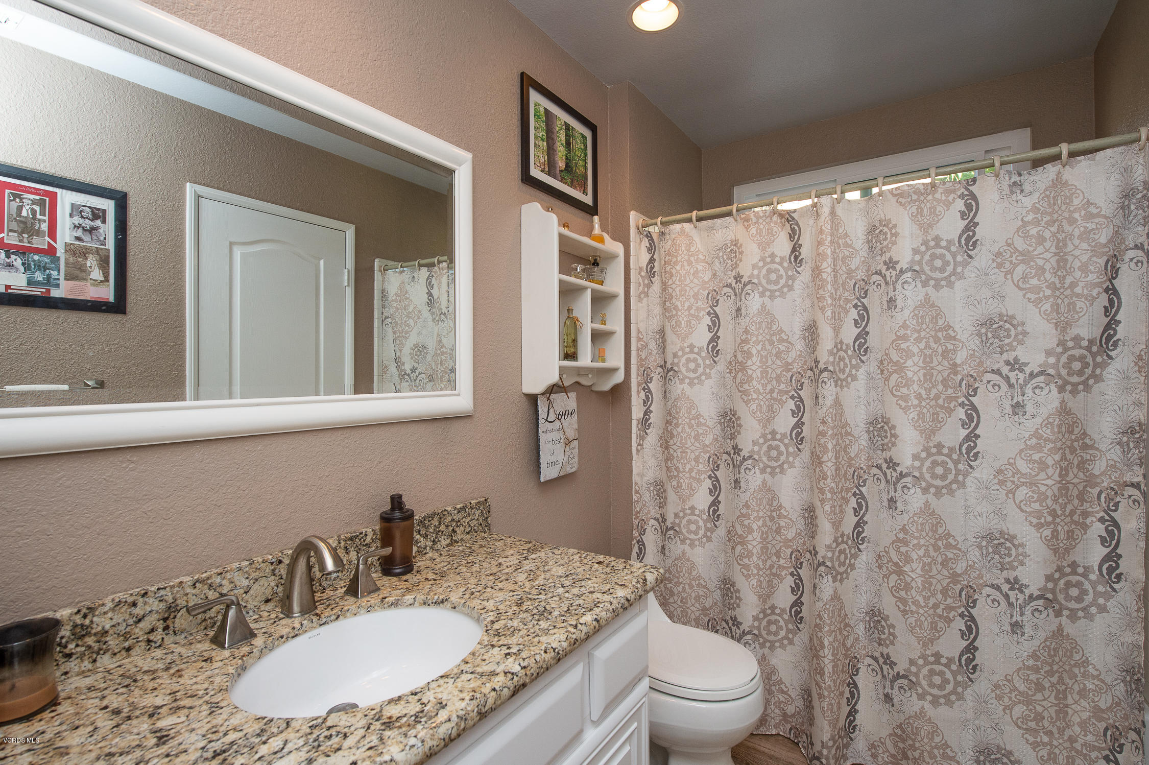 7354 Griffith Lane Moorpark, CA 93021 - Photo 22 of 53 a bathroom with a granite countertop sink toilet and shower