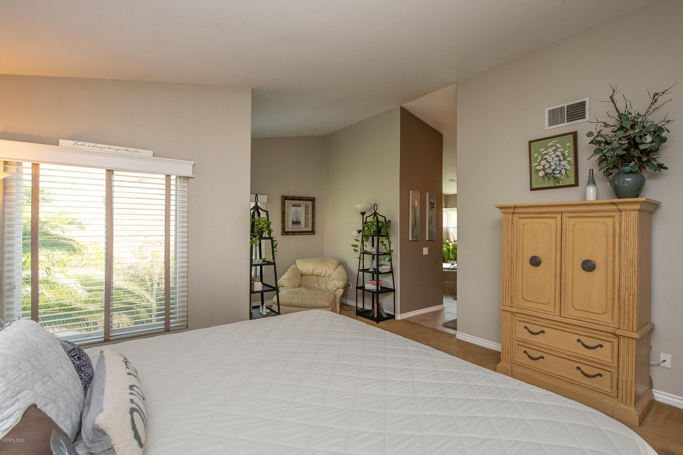 7354 Griffith Lane Moorpark, CA 93021 - Photo 37 of 53 a bedroom with a bed and wooden floor