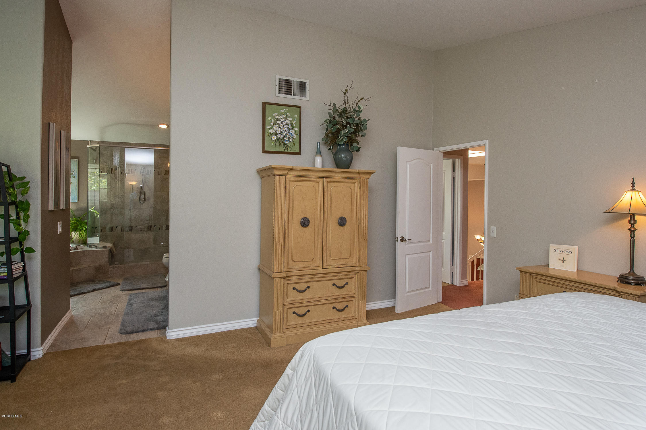 7354 Griffith Lane Moorpark, CA 93021 - Photo 38 of 53 a bedroom with a bed and a mirror