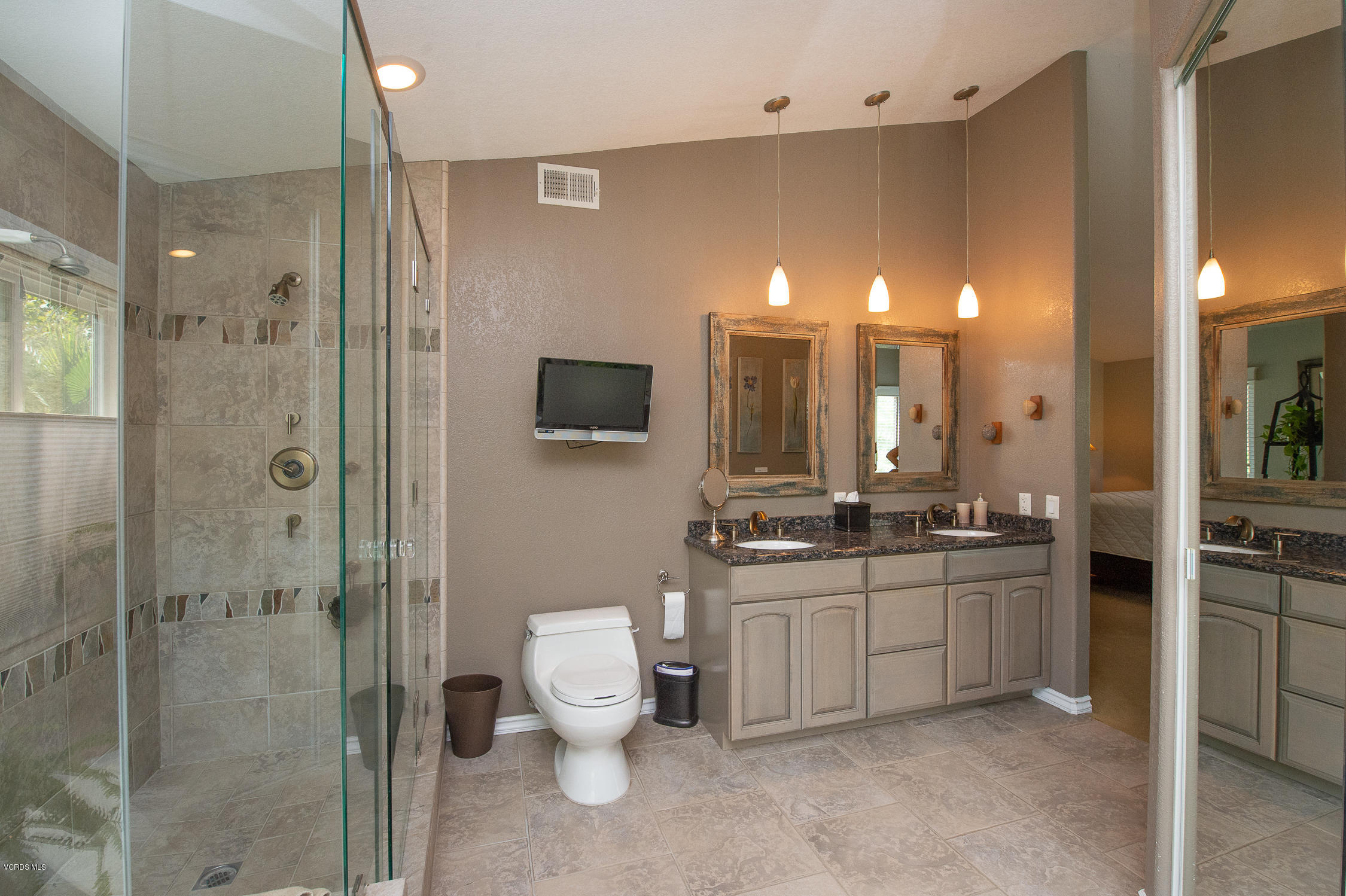 7354 Griffith Lane Moorpark, CA 93021 - Photo 44 of 53 a large bathroom with a toilet a sink and a mirror