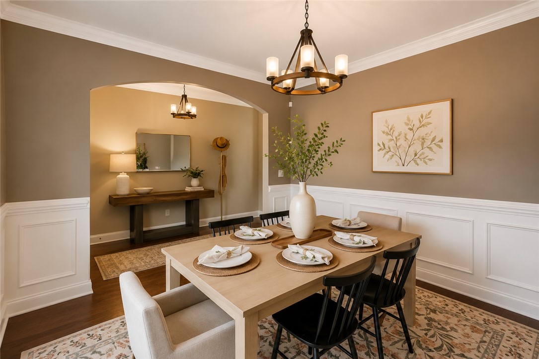15 Fawn Hill Drive Anderson, SC 29621 - Photo 5 of 38 Elegant dining space featuring intricate crown molding and wainscoting.