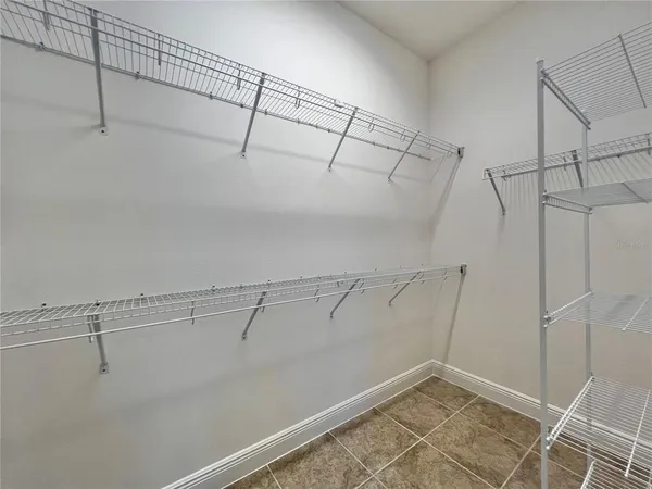 a view of a room with racks on the wall