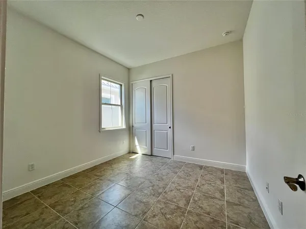 a house view with a sitting space and garden space