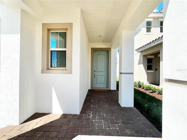 a view of a hallway with entryway and front door