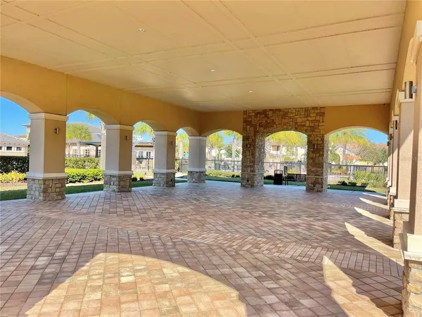 a view of a swimming pool with a patio