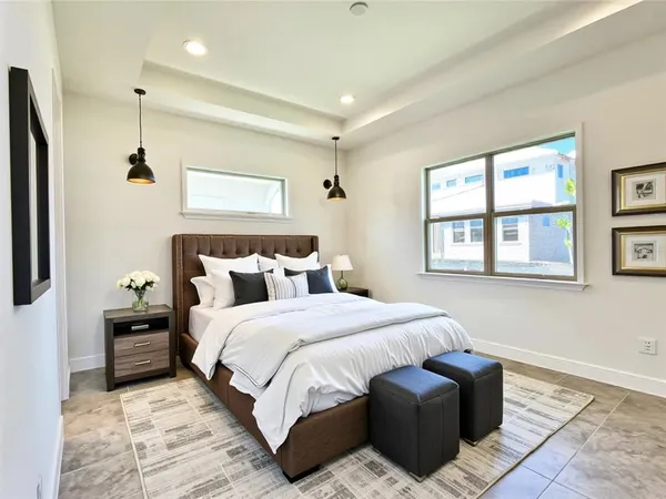 a bedroom with bed and window