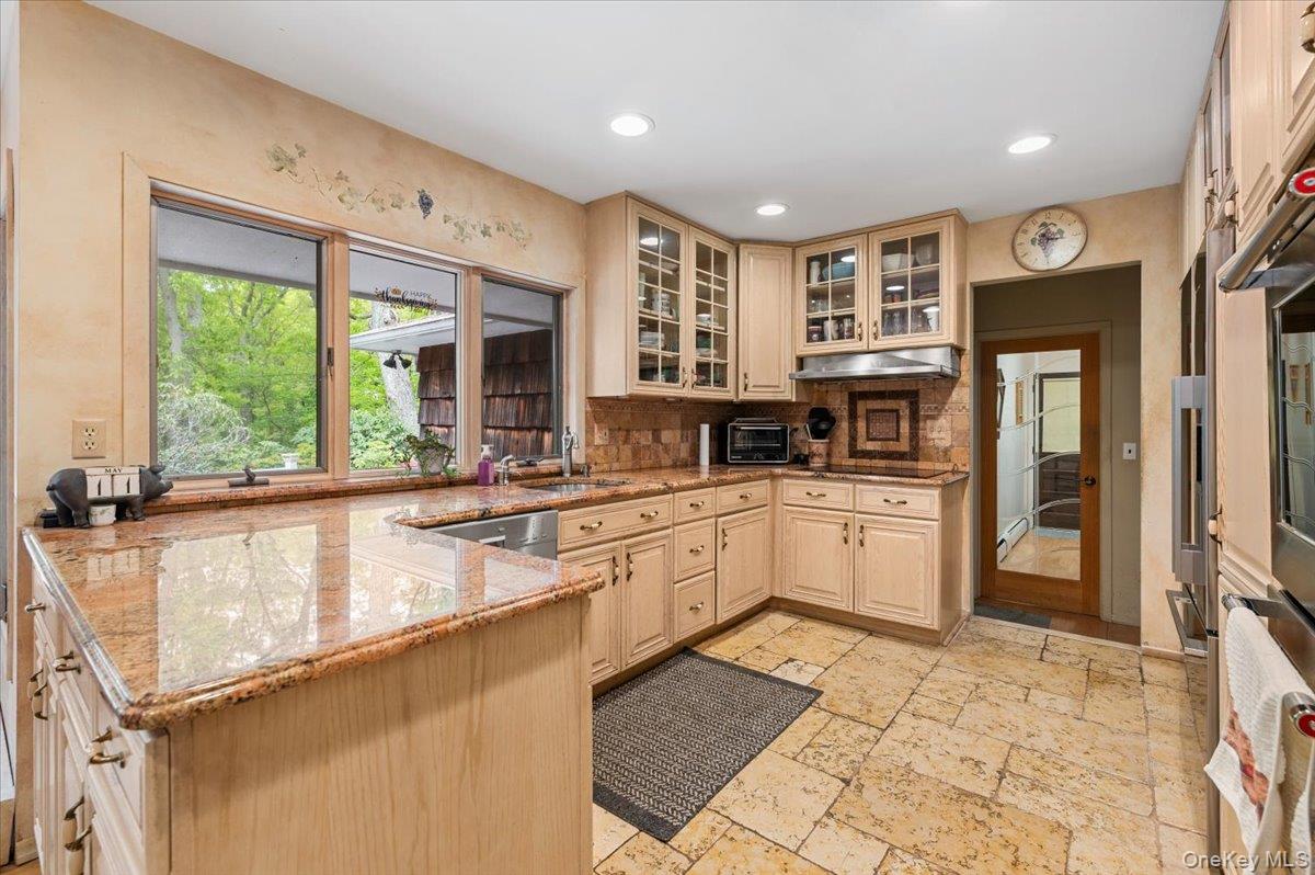 6 Apex Road Melville, NY 11747 - Photo 14 of 50 a large kitchen with a large window and stainless steel appliances
