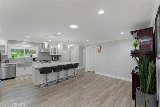 a view of a dining room with furniture wooden floor and a rug