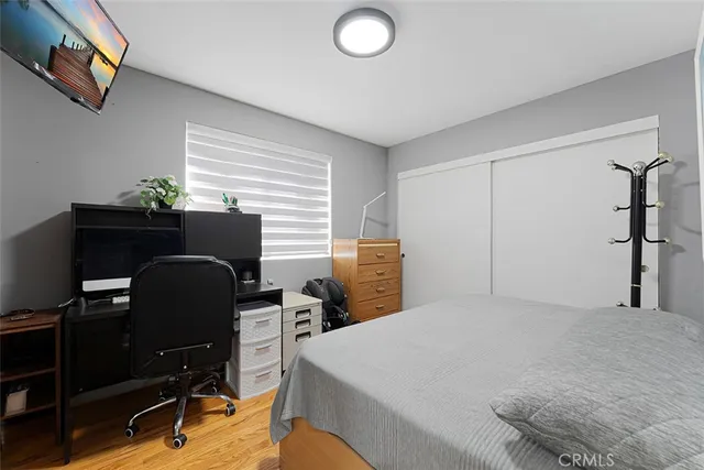 a bedroom with a workspace