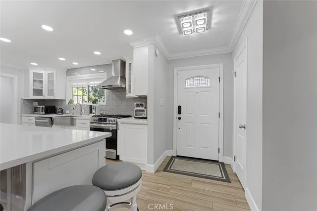 a kitchen with a sink a stove and refrigerator