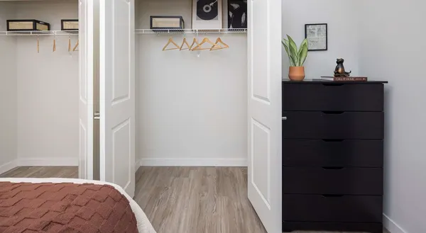 a bedroom with a bed and a dresser