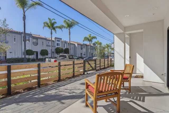 a view of a chairs and table in a patio