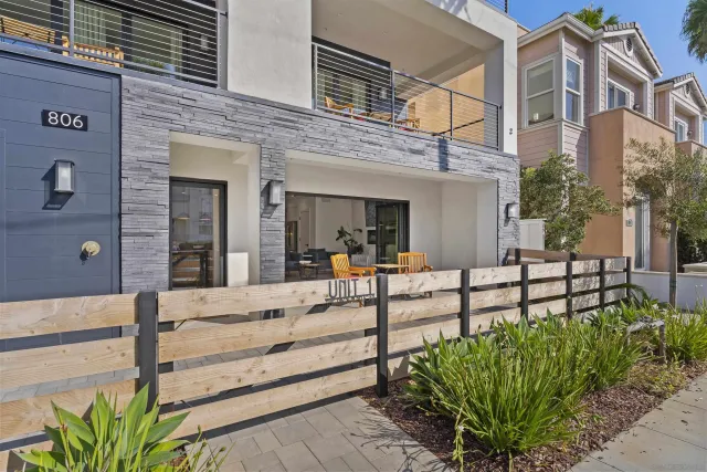 a view of a house with a small yard and plants