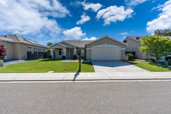a house with yard in front of it