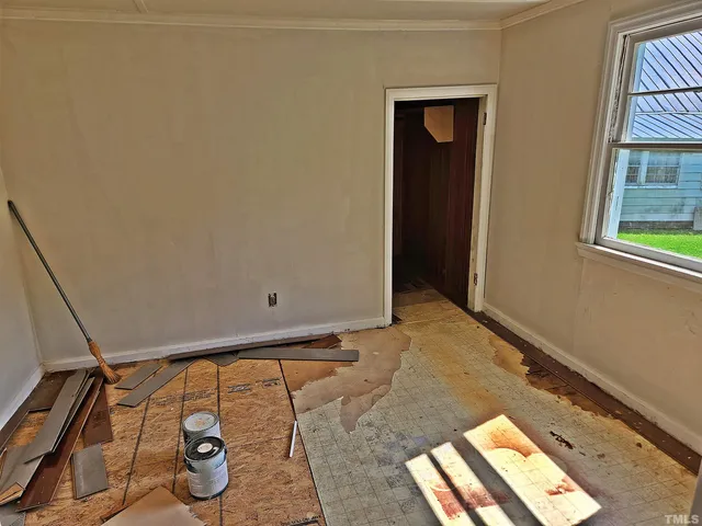 a view of an empty room and window
