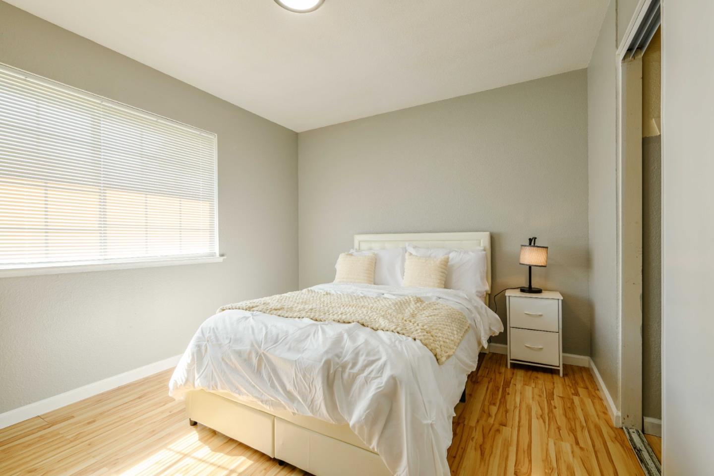 8617 Lodestone Circle Elk Grove, CA 95624 - Photo 12 of 23 a bedroom with a bed and window