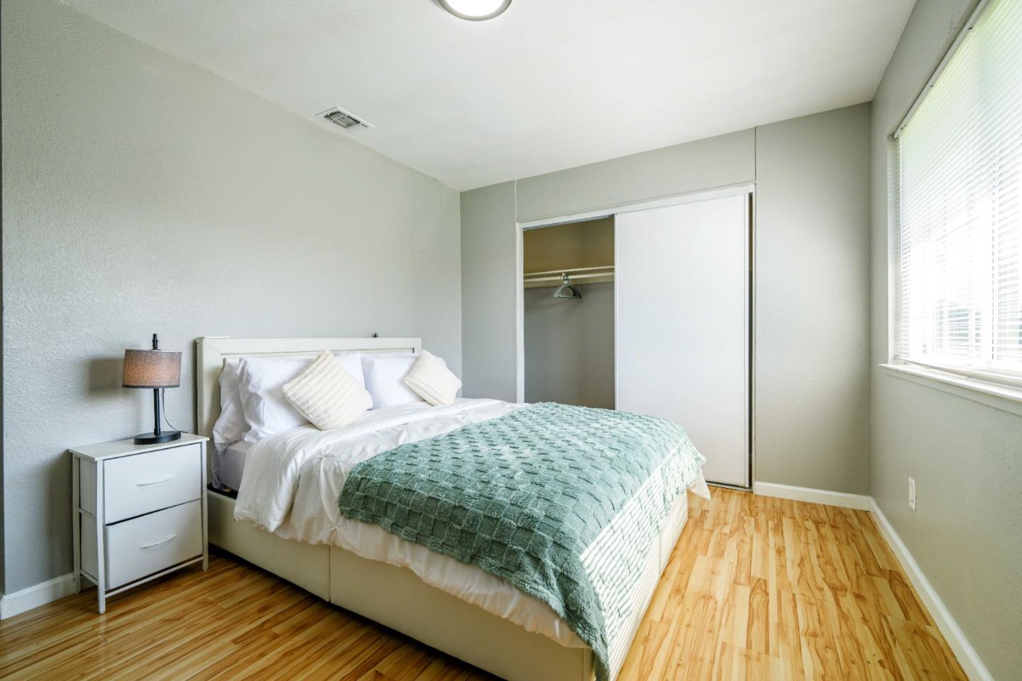 8617 Lodestone Circle Elk Grove, CA 95624 - Photo 13 of 23 a bedroom with a bed and wooden floor