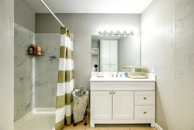 a bathroom with a sink and a mirror