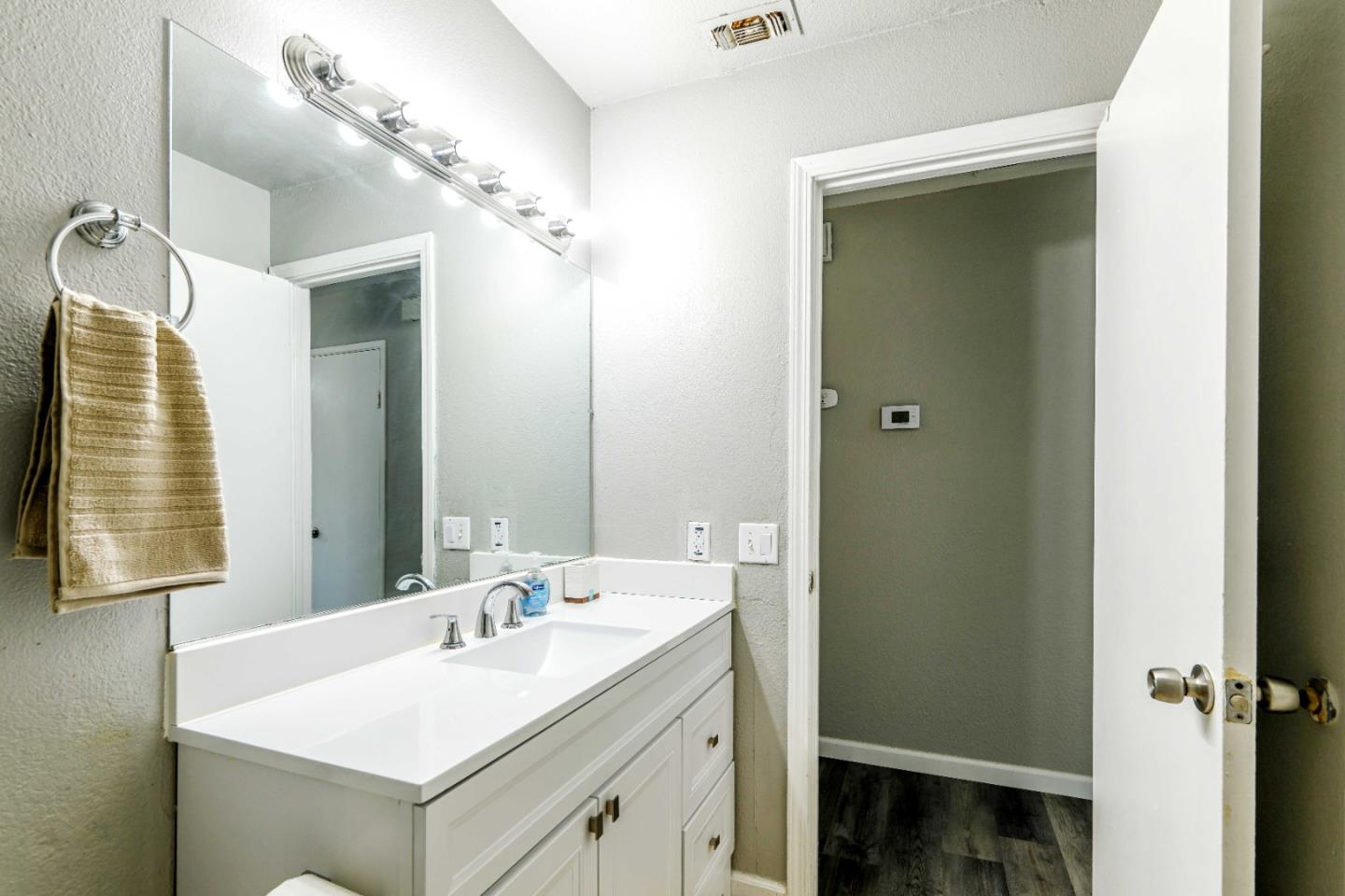 8617 Lodestone Circle Elk Grove, CA 95624 - Photo 17 of 23 a bathroom with a sink and a mirror