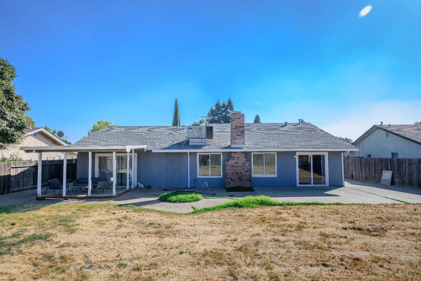 8617 Lodestone Circle Elk Grove, CA 95624 - Photo 19 of 23 a front view of a house with a garden and yard