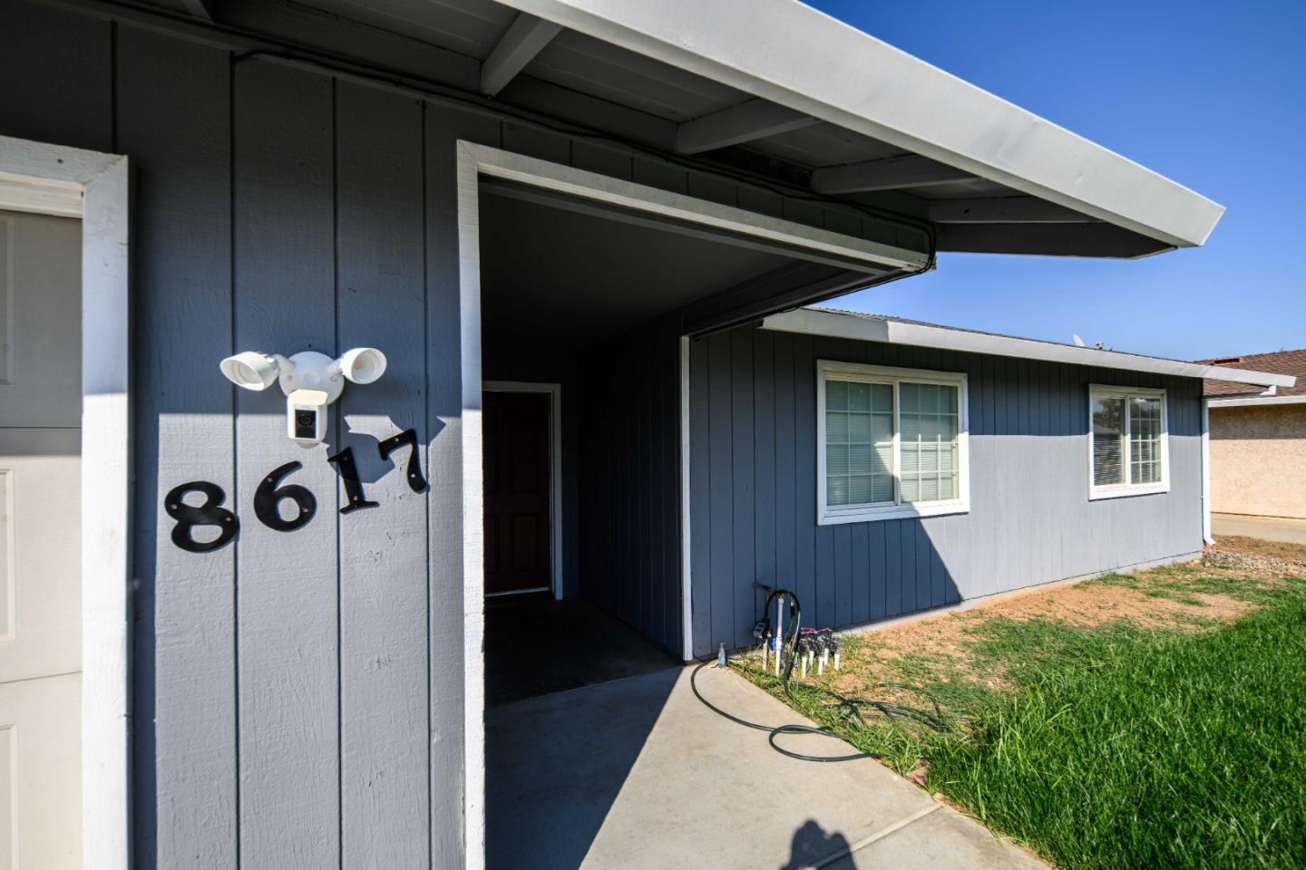 8617 Lodestone Circle Elk Grove, CA 95624 - Photo 21 of 23 a bedroom with a bed and a chandelier
