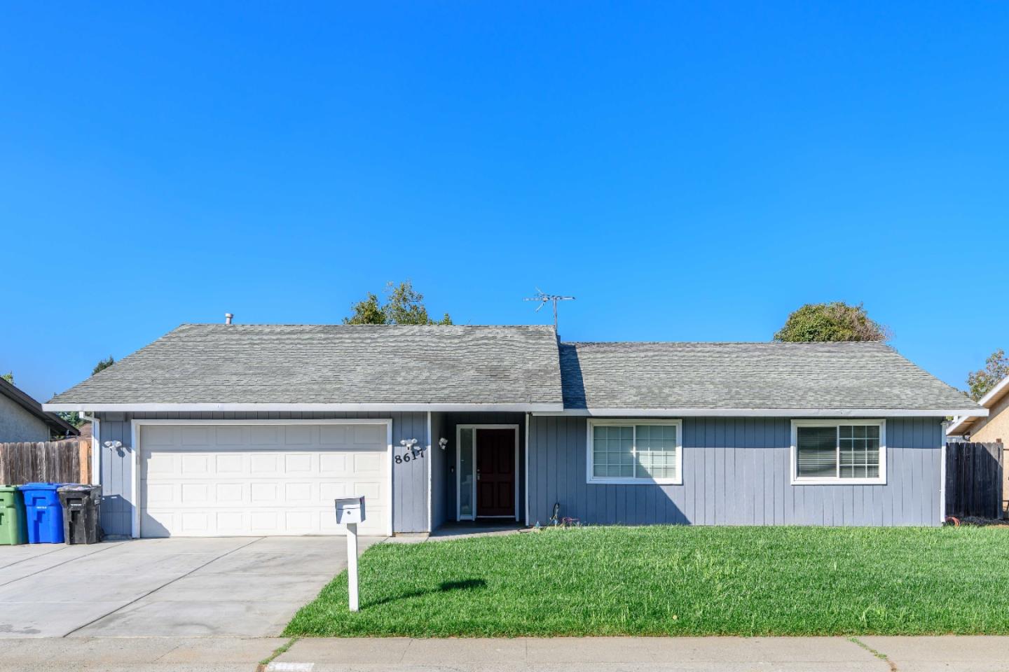 8617 Lodestone Circle Elk Grove, CA 95624 - Photo 23 of 23 a front view of a house with a yard and garage