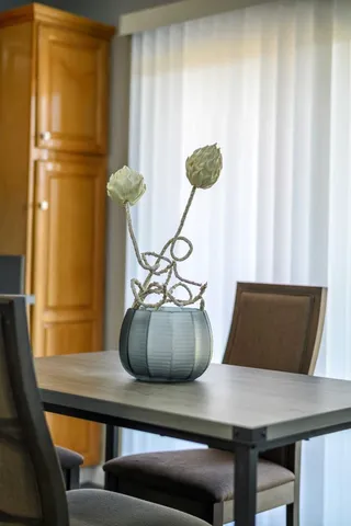 a view of table chair and window