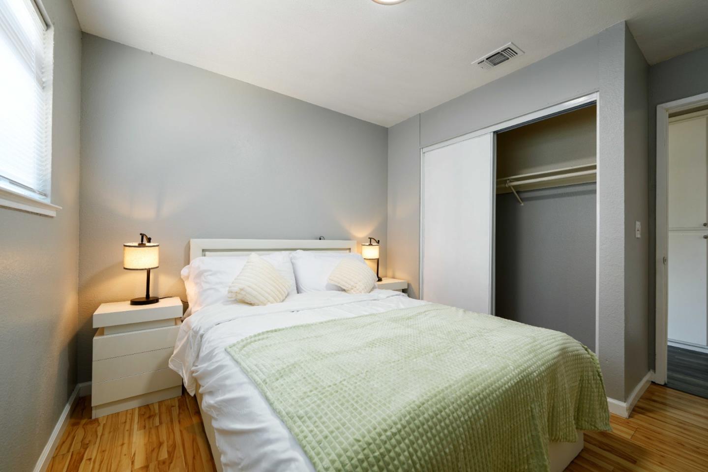 8617 Lodestone Circle Elk Grove, CA 95624 - Photo 9 of 23 a bedroom with a bed and a night stand