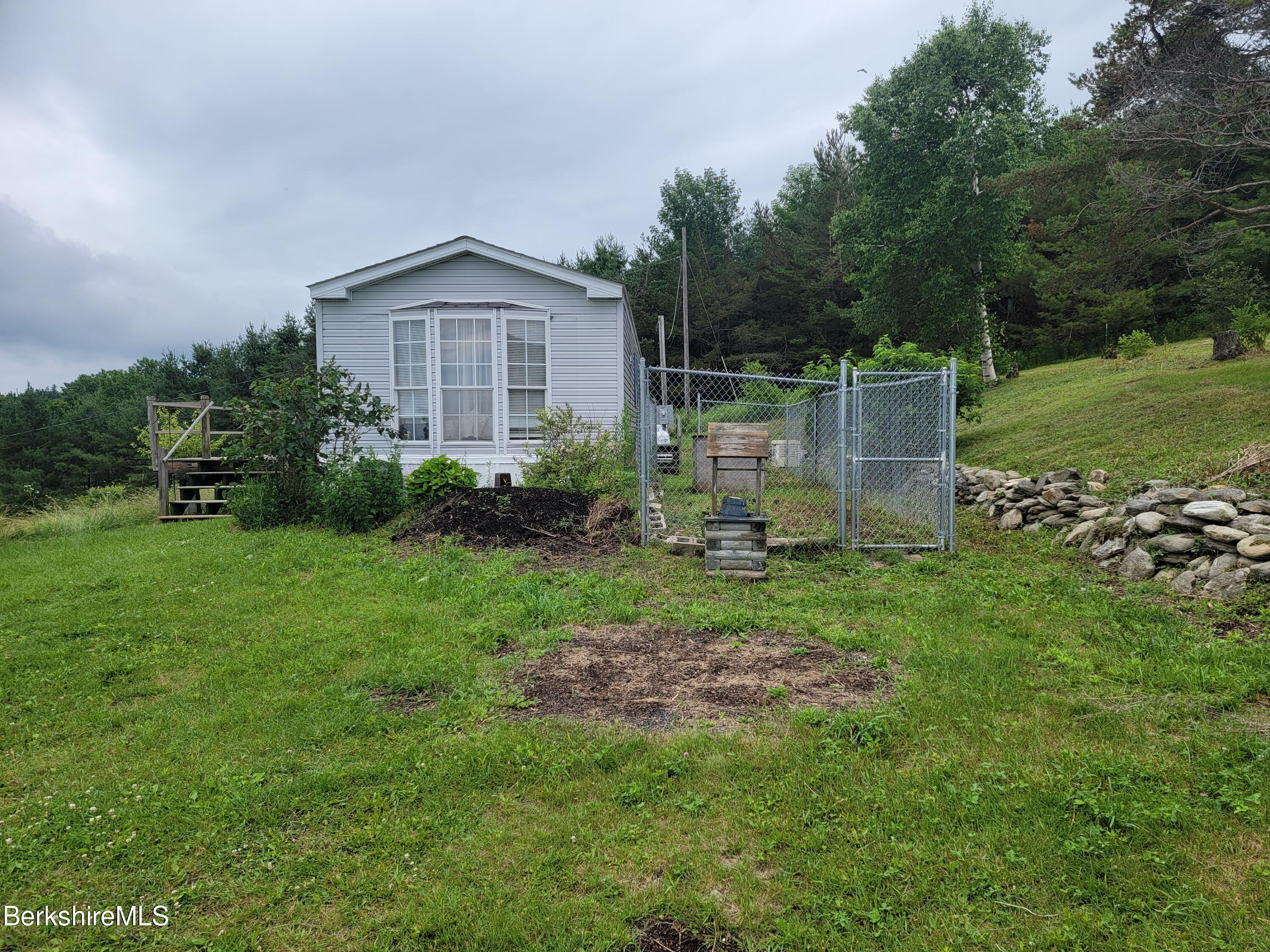 47 Moore's Road North Adams, MA 01247 - Photo 2 of 19 a backyard of a house with lots of green space