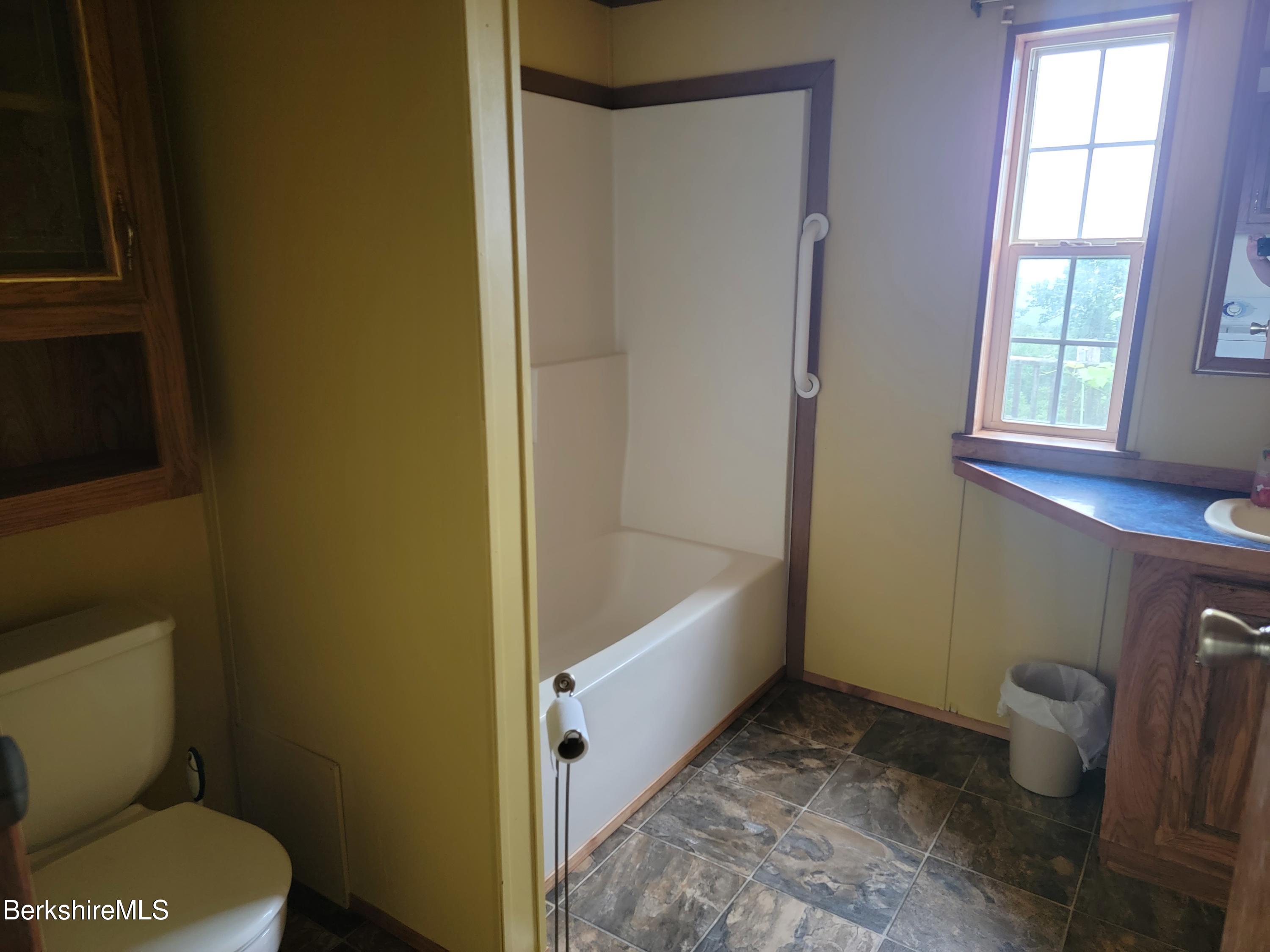 47 Moore's Road North Adams, MA 01247 - Photo 10 of 19 a bathroom with a granite countertop toilet and a bathtub