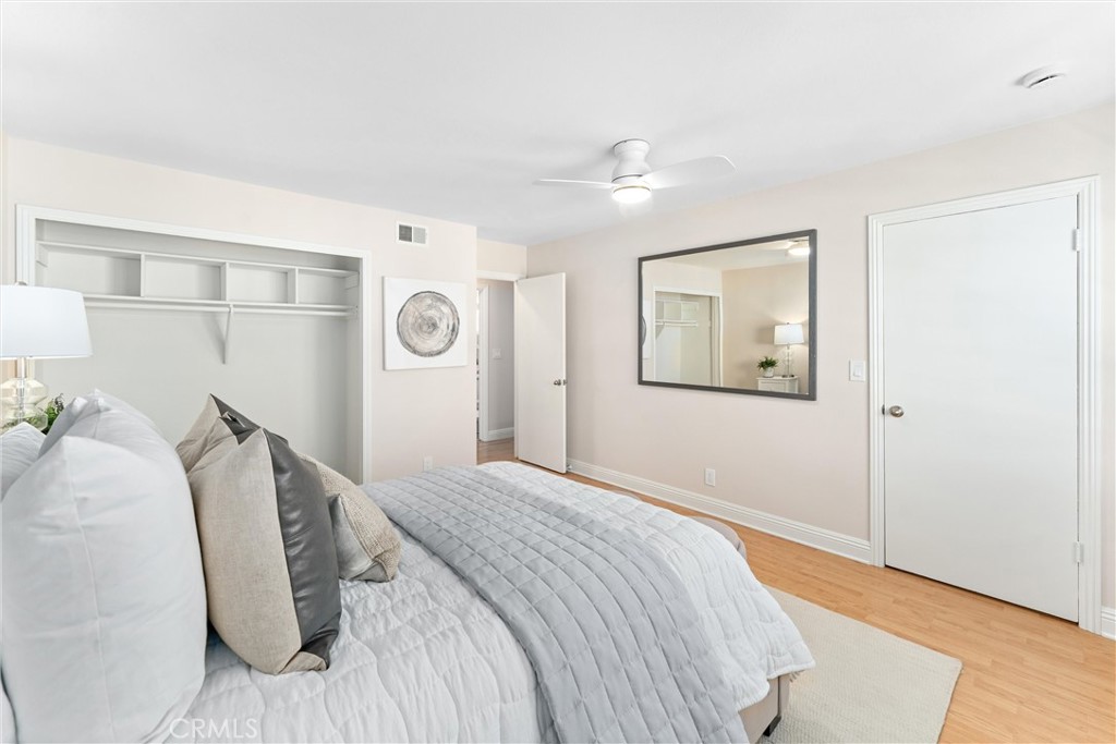 8236 Henderson Green Buena Park, CA 90621 - Photo 18 of 35 a bedroom with a bed and a painting on the wall