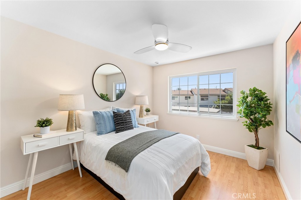 8236 Henderson Green Buena Park, CA 90621 - Photo 20 of 35 a bedroom with bed and a potted plant