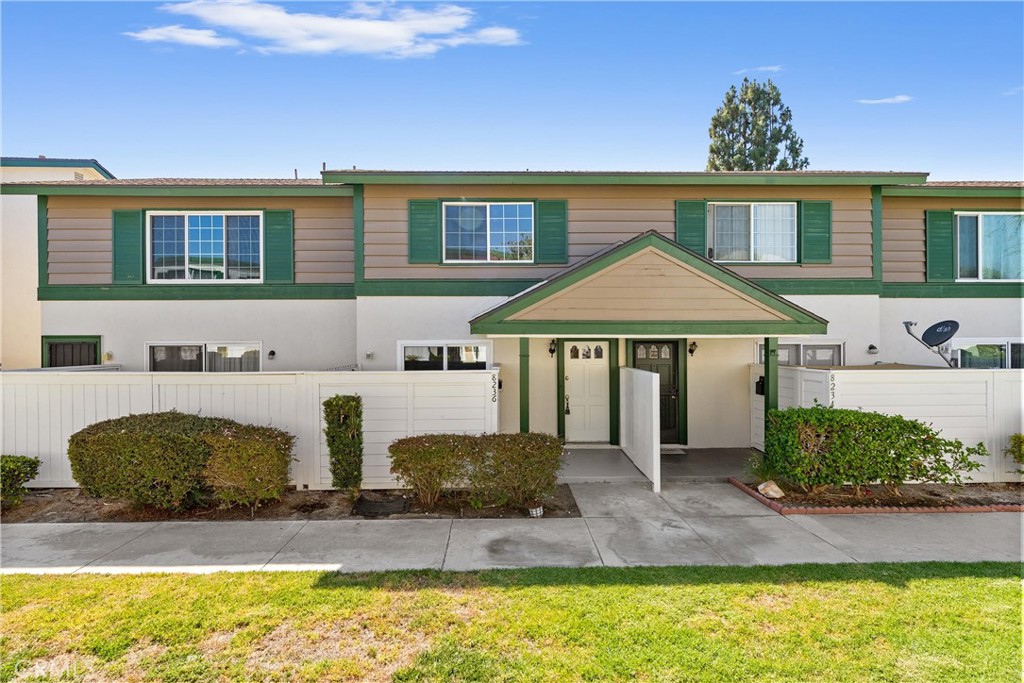 8236 Henderson Green Buena Park, CA 90621 - Photo 2 of 35 a front view of a house with a yard
