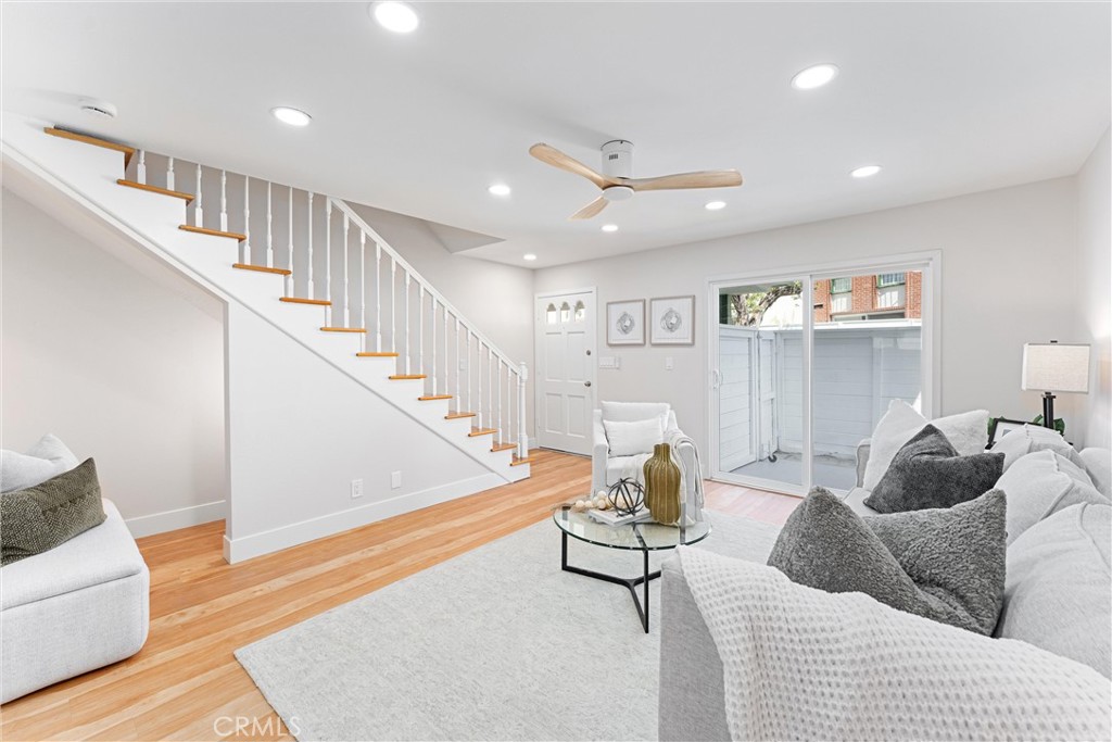 8236 Henderson Green Buena Park, CA 90621 - Photo 4 of 35 a living room with furniture and a ceiling fan