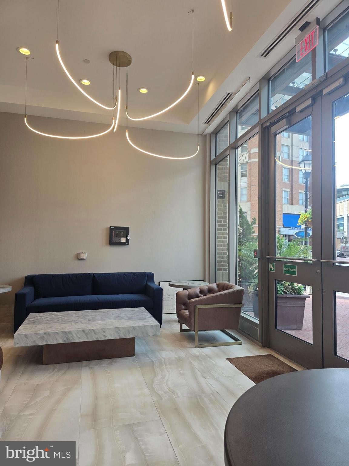 675 President Street, Unit 1609 Baltimore, MD 21202 - Photo 11 of 13 a spacious bedroom with a bed and large window